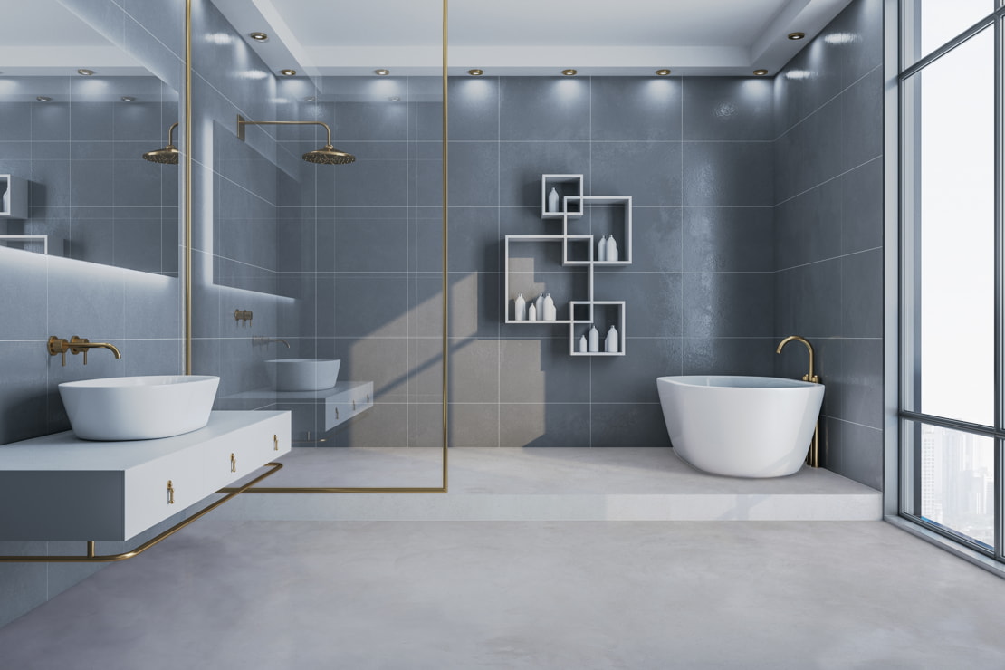 Microcement floors in a luxury bathroom with neutral tones and a minimalist ambience