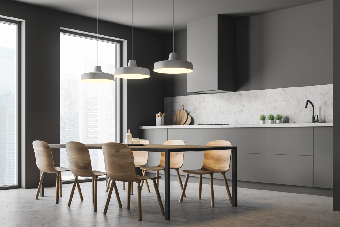 Microcement in a kitchen with grey tones and views to the exterior