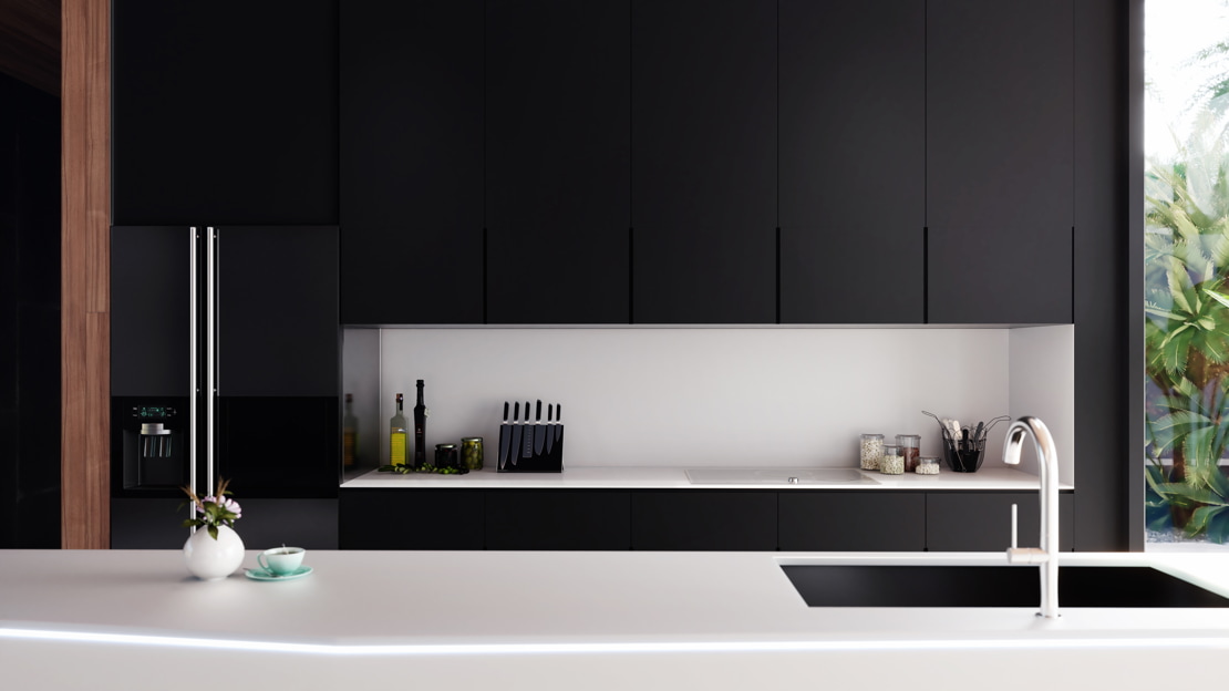 Microcement worktop in a kitchen where the combination of light and dark tones generates a contrast.