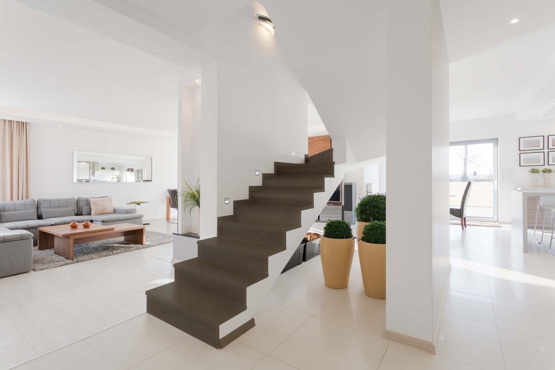 Microcement staircase in a spacious and bright living room