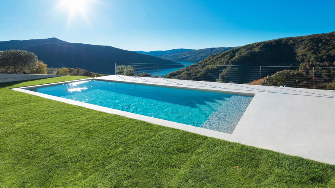 Microcement swimming pool in a garden with mountain views