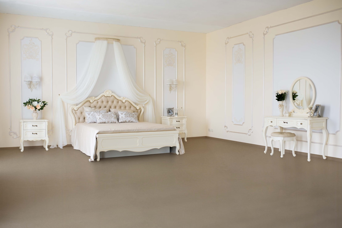 Luxury room with a microcement floor that enhances the spaciousness and classic style of the room